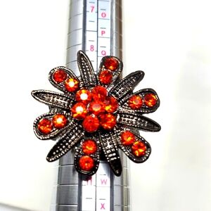 Orange Flower Silvertone Stretch Ring Starburst